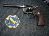 Colt Official Police
.38 Spec. 6"HB MFG 1955 Excellent
all Original
With Full Checkered Walnut Target Stocks Silver Medallions - 14 of 14