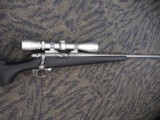 REMINGTON 700 TITANIUM WITH MCGOWEN 7MM-08 AND LEUPOLD VARIX IIC 3-9X40 - 2 of 20