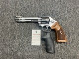 Smith & Wesson 617-4 10 shot .22LR w/ box and extra grips - Image 1 of 7