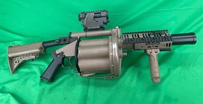 Milkor M32 MGL 40MM USMC 6 Round Rotary Grenade Launcher FDE - Image 1 of 9