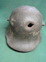 WWI WWII German Helmet with Bullet or Shrapnel Hole - 1 of 12