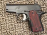 KIMBER MICRO CARRY .380 ACP WITH ROSEWOOD CRIMSON TRACE LASER - 1 of 6