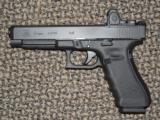 GLOCK MODEL 34 LONG-SLIDE MOS 9 MM PISTOL WITH PRE-MOUNTED TRIJICON RMR OPTICAL SIGHT - 1 of 5