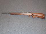 SAVAGE MODEL 93 BTVS RIFLE IN .22 MAGNUM WITH THUMBHOLE LAMINATED STOCK - 1 of 7