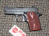 SIG SAUER P-938 IN 9 MM WITH NIGHT SIGHTS AND ROSEWOOD GRIPS - 1 of 5