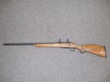 REMINGTON 700 VARMINTER RIFLE IN .22-250 HEAVY BARREL LAMINATED STOCK - 1 of 7