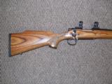 REMINGTON 700 VARMINTER RIFLE IN .22-250 HEAVY BARREL LAMINATED STOCK - 6 of 7