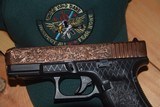 CUSTOM GLOCK MODEL 17 COPPER-PLATED & ENGRAVED....REDUCED WITH SHIPPING.... - 1 of 11