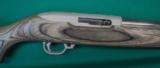 Ruger 10/22 Varmint with laminated stock and polished SS barrel.- 1 of 5