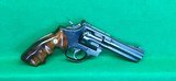 S&W 22 LR model 17-6, 4 inch full lug barrel with combat grips. - 1 of 3