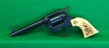 Hi-Standard double nine 22 LR revolver with faux stag grips. - 1 of 4