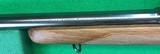 Pre-64 M70 Winchester from 1952 with 2-7X Burris scope. - 9 of 14