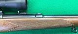 Pre-64 M70 Winchester from 1952 with 2-7X Burris scope. - 8 of 14