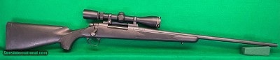 Remington ADL in 300 Win Mag with 4-12X Leupold Rifleman scope.