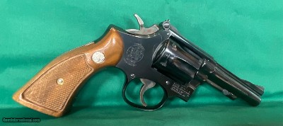 S&W model 18-3, 22 LR with 4 inch barrel, original grips.