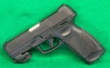 Taurus G3 9mm with Crimson trace red dot.