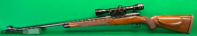 Winchester M70 Sper Grade pre 64 in 300 H&H with G&H mt & Redfield scope.