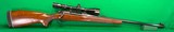 Pre-64 Winchester model 70 in 375 H&H magnum with newer Redfield scope.