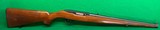 Early Ruger 10/22 Mannlicher, walnut with plastic buttplate.