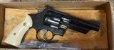 Smith & Wesson model 24 3, NIB with synthetic ivory grips, four inch barrel.