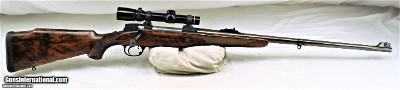 HOLLAND & HOLLAND DELUXE .375 MAGNUM MAGAZINE RIFLE WITH SCOPE