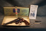 S+W K-22 Masterpiece 22LR with engraved inscription,box and papers
