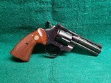COLT PYTHON - BLUED. 4 INCH BARREL. ORIGINAL GRIPS. W-OWNERS MANUAL. NEAR MINT AND GORGEOUS! MFG. IN 1976 - .357 MAGNUM - 2 of 15