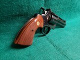 COLT PYTHON - BLUED. 4 INCH BARREL. ORIGINAL GRIPS. W-OWNERS MANUAL. NEAR MINT AND GORGEOUS! MFG. IN 1976 - .357 MAGNUM - 3 of 15