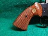 COLT PYTHON - BLUED. 4 INCH BARREL. ORIGINAL GRIPS. W-OWNERS MANUAL. NEAR MINT AND GORGEOUS! MFG. IN 1976 - .357 MAGNUM - 8 of 15
