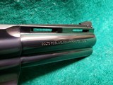 COLT PYTHON - BLUED. 4 INCH BARREL. ORIGINAL GRIPS. W-OWNERS MANUAL. NEAR MINT AND GORGEOUS! MFG. IN 1976 - .357 MAGNUM - 9 of 15