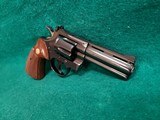 COLT PYTHON - BLUED. 4 INCH BARREL. ORIGINAL GRIPS. W-OWNERS MANUAL. NEAR MINT AND GORGEOUS! MFG. IN 1976 - .357 MAGNUM - 4 of 15