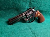 COLT PYTHON - BLUED. 4 INCH BARREL. ORIGINAL GRIPS. W-OWNERS MANUAL. NEAR MINT AND GORGEOUS! MFG. IN 1976 - .357 MAGNUM - 6 of 15