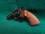 COLT PYTHON - BLUED. 4 INCH BARREL. ORIGINAL GRIPS. W-OWNERS MANUAL. NEAR MINT AND GORGEOUS! MFG. IN 1976 - .357 MAGNUM - 7 of 15