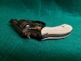 Smith & Wesson - MODEL 36 FLAT LATCH - BEAUTIFULLY ENGRAVED BY CECIL MILLS W-GOLD INLAYS. REAL PEARL GRIPS. MFG. CIRCA 1950-1969 - .38 Special - 25 of 25