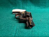Smith & Wesson - MODEL 36 FLAT LATCH - BEAUTIFULLY ENGRAVED BY CECIL MILLS W-GOLD INLAYS. REAL PEARL GRIPS. MFG. CIRCA 1950-1969 - .38 Special - 23 of 25