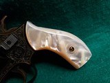 Smith & Wesson - MODEL 36 FLAT LATCH - BEAUTIFULLY ENGRAVED BY CECIL MILLS W-GOLD INLAYS. REAL PEARL GRIPS. MFG. CIRCA 1950-1969 - .38 Special - 9 of 25
