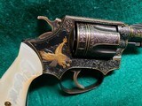 Smith & Wesson - MODEL 36 FLAT LATCH - BEAUTIFULLY ENGRAVED BY CECIL MILLS W-GOLD INLAYS. REAL PEARL GRIPS. MFG. CIRCA 1950-1969 - .38 Special - 10 of 25