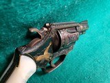 Smith & Wesson - MODEL 36 FLAT LATCH - BEAUTIFULLY ENGRAVED BY CECIL MILLS W-GOLD INLAYS. REAL PEARL GRIPS. MFG. CIRCA 1950-1969 - .38 Special - 18 of 25