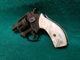 Smith & Wesson - MODEL 36 FLAT LATCH - BEAUTIFULLY ENGRAVED BY CECIL MILLS W-GOLD INLAYS. REAL PEARL GRIPS. MFG. CIRCA 1950-1969 - .38 Special - 6 of 25