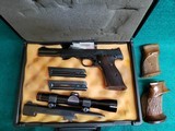 Smith & Wesson - MODEL 41 WITH 2 BARRELS (5.5 AND 7 INCH). LEUPOLD SCOPE. 3 MAGAZINES. AND 3 SETS OF GRIPS. NEAR MINT! - .22 LR - 1 of 25