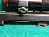 Smith & Wesson - MODEL 41 WITH 2 BARRELS (5.5 AND 7 INCH). LEUPOLD SCOPE. 3 MAGAZINES. AND 3 SETS OF GRIPS. NEAR MINT! - .22 LR - 25 of 25