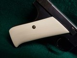 COLT - WOODSMAN. FIRST SERIES. 6.5 INCH BARREL. W-ONE MAG. W-BEAUTIFUL HAND CARVED IVORY GRIPS. NICE BORE! MFG. IN 1939 - .22 LR - 9 of 23