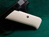 COLT - WOODSMAN. FIRST SERIES. 6.5 INCH BARREL. W-ONE MAG. W-BEAUTIFUL HAND CARVED IVORY GRIPS. NICE BORE! MFG. IN 1939 - .22 LR - 21 of 23