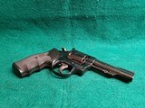 Smith & Wesson - MODEL 15-4. BLUED. DOUBLE ACTION. 4 INCH BARREL. PACHMAYR GRIPS. BEAUTIFUL GUN W-NICE BORE! MFG. IN 1981 - .38 SPECIAL - 13 of 25