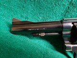 Smith & Wesson - MODEL 15-4. BLUED. DOUBLE ACTION. 4 INCH BARREL. PACHMAYR GRIPS. BEAUTIFUL GUN W-NICE BORE! MFG. IN 1981 - .38 SPECIAL - 15 of 25