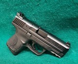 Smith & Wesson - M&P9C. COMPACT. 3.5" BARREL. IN ORIGINAL CASE. W-2 10 MAGS AND BACK STRAPS. TRIJICON HD NIGHT SIGHTS. NEAR NEW! - 9mm Luger - 4 of 23