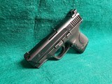 Smith & Wesson - M&P9C. COMPACT. 3.5" BARREL. IN ORIGINAL CASE. W-2 10 MAGS AND BACK STRAPS. TRIJICON HD NIGHT SIGHTS. NEAR NEW! - 9mm Luger - 6 of 23