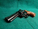 TAURUS - 669 COMP. DOUBLE ACTION REVOLVER. BLUED. 4" PORTED BARREL. W-ORIGINAL BOX AND OWNERS MANUAL. EXCELLENT CONDITION! - .357 MAGNUM - 17 of 18