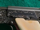 Colt - WOODSMAN. MATCH TARGET. 3RD MODEL. 4.5" BARREL. IVORY GRIPS. EXQUISITELY ENGRAVED BY MASTER ENGRAVER CLINT FINLEY. MFG IN 1972 - .22 LR - 24 of 26