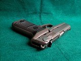 RUGER - P94DC. 4" BARREL. W-ONE 10 ROUND MAGAZINE. NICE BORE! MFG. IN 1997 - .40 S&W - 17 of 17